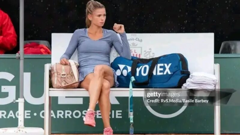 Camila Giorgi of Italy looks on during a rain shower during WTA Ladies Open