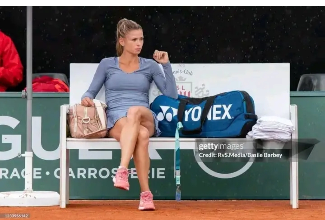 Camila Giorgi of Italy looks on during a rain shower during WTA Ladies Open