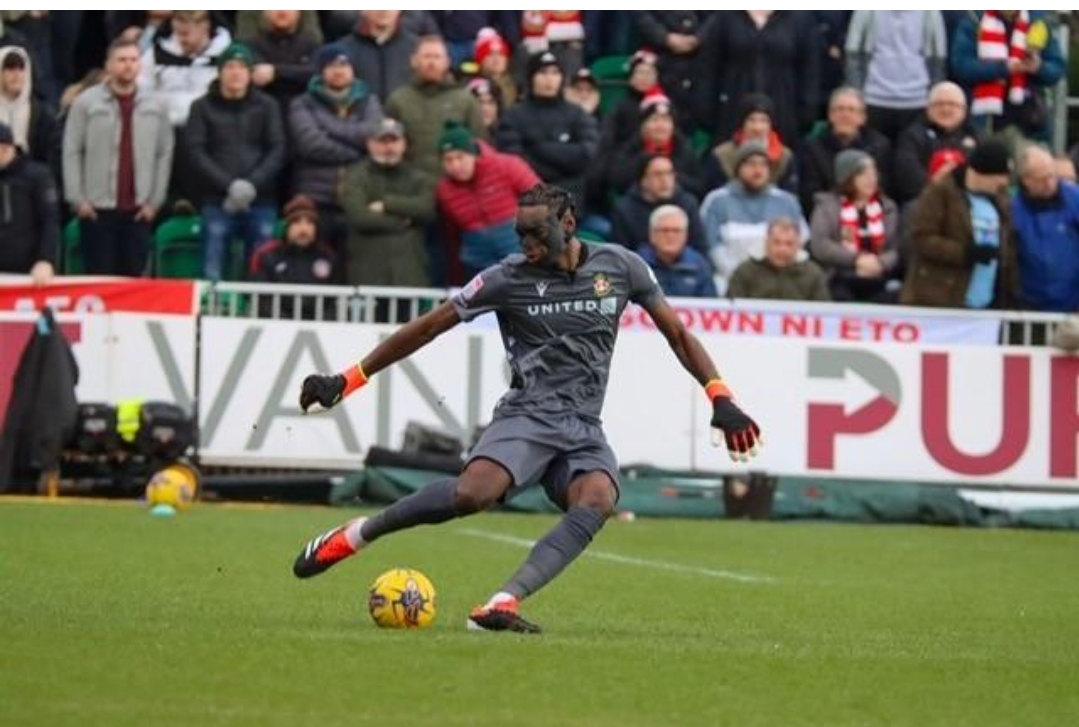 ARTHUR OKONKWO will definitely remain with Wrexham until the end of the season and the goalkeeper couldn’t be happier!