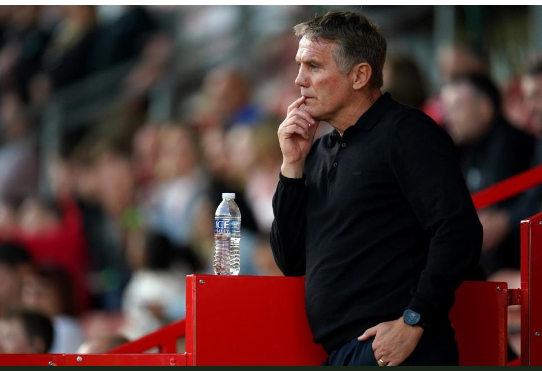 Wrexham manager Phil Parkinson watches the Carabao Cup first round match at Stoke Racecourse in Wrexham