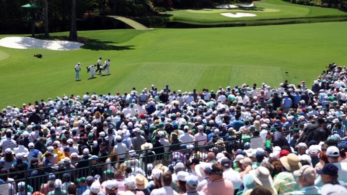 Adoring Augusta cheers Tiger into another Masters weekend